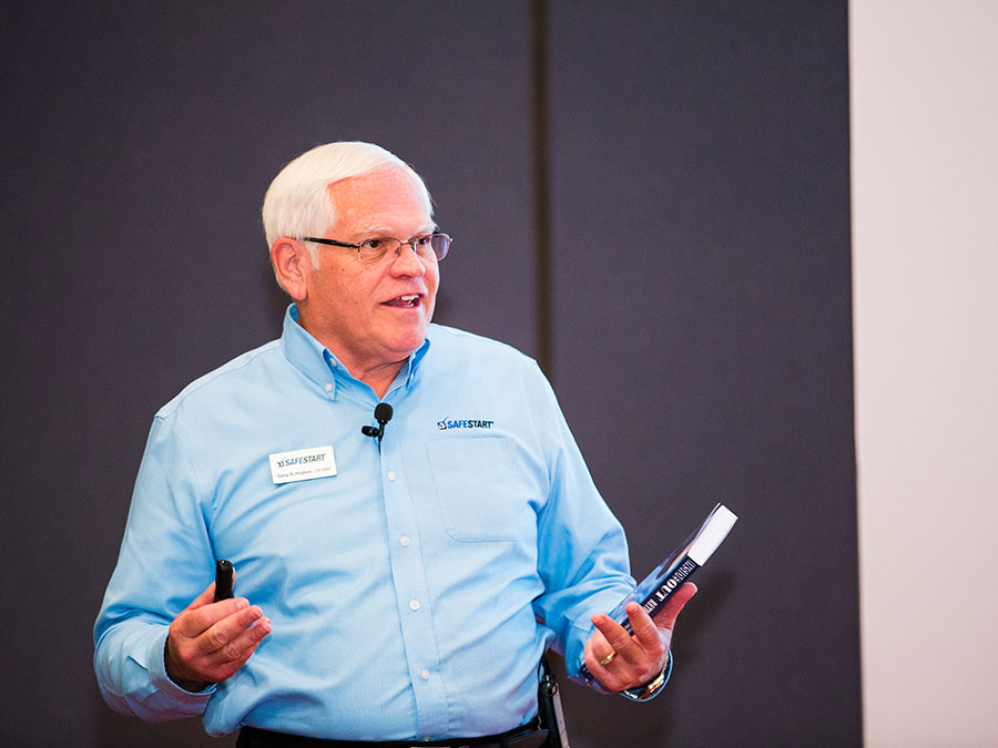 Gary A. Higbee discusses safety at a DuPont forum in Lima, Peru