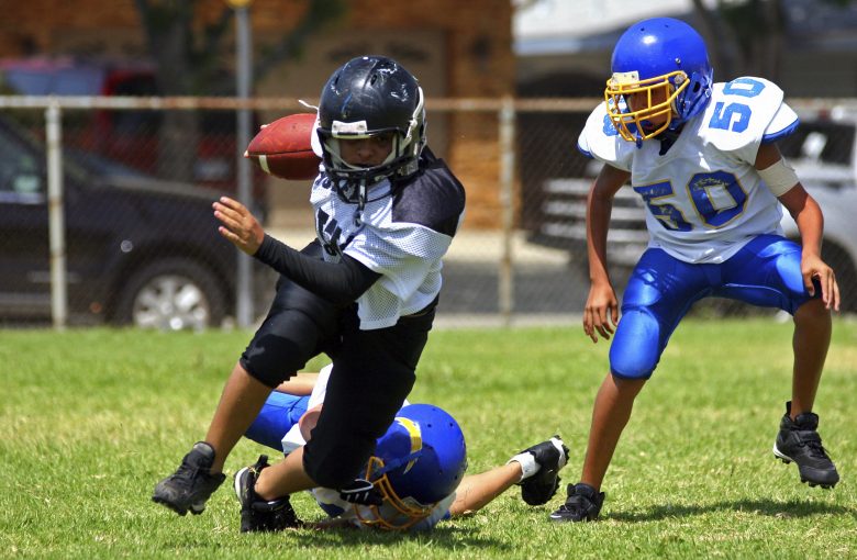 Kids playing football