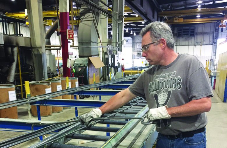 A man works at Plymouth Tube's Streator mill