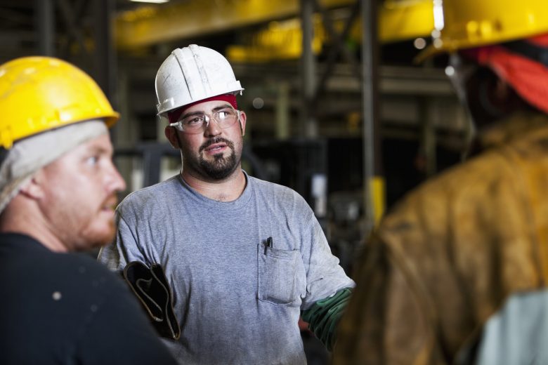 Construction workers engaged in a Toolbox Talk