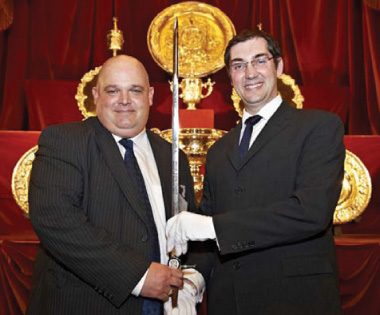 Mike Howells (left) receiving the British Safety Council’s Sword of Honour