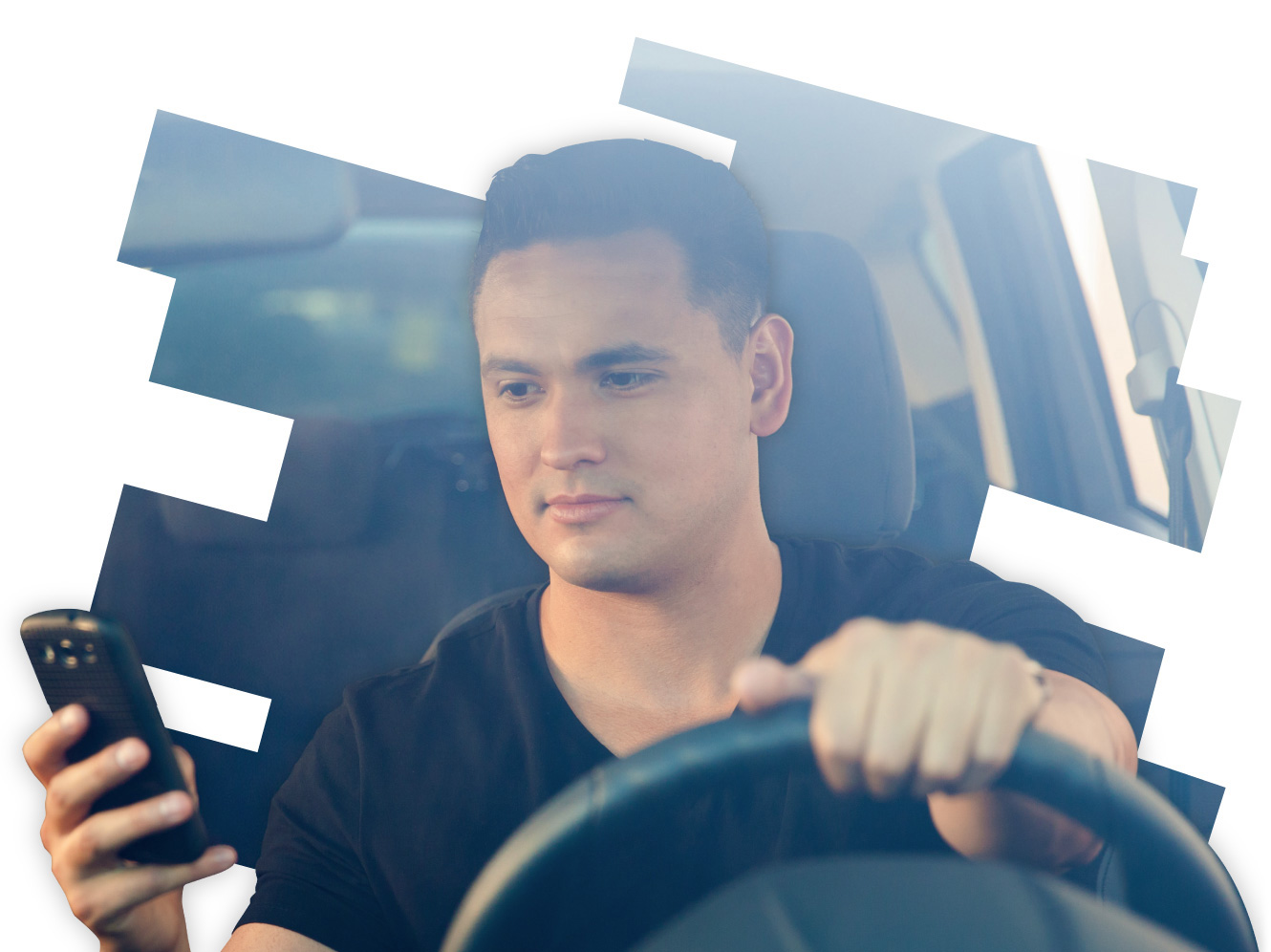 A man distracted by his phone while driving