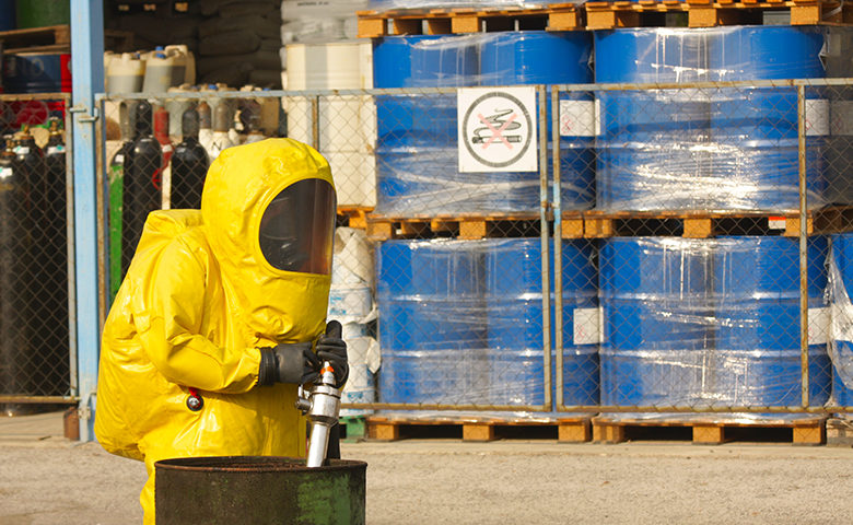 Collecting hazardous material in hazmat suit