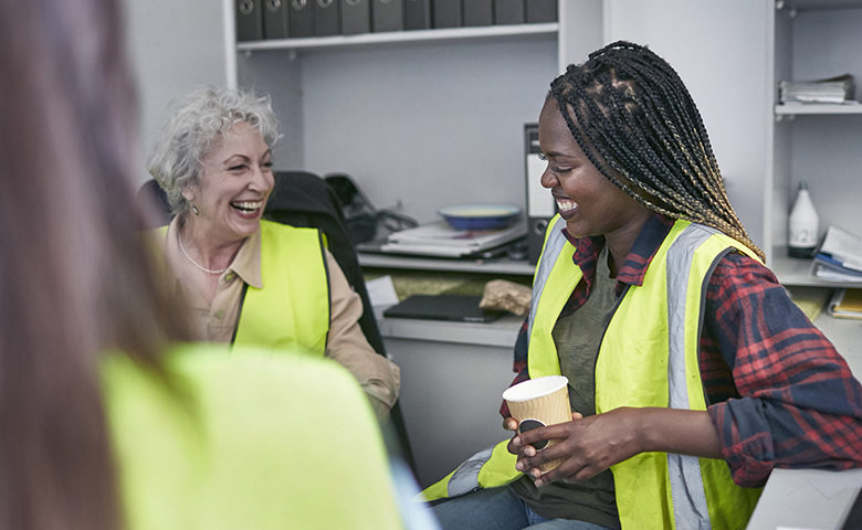 Female workers laughing showing engagement in a good company culture