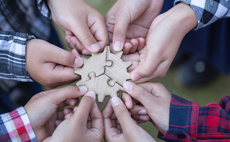 Employees engaged at putting a puzzle together