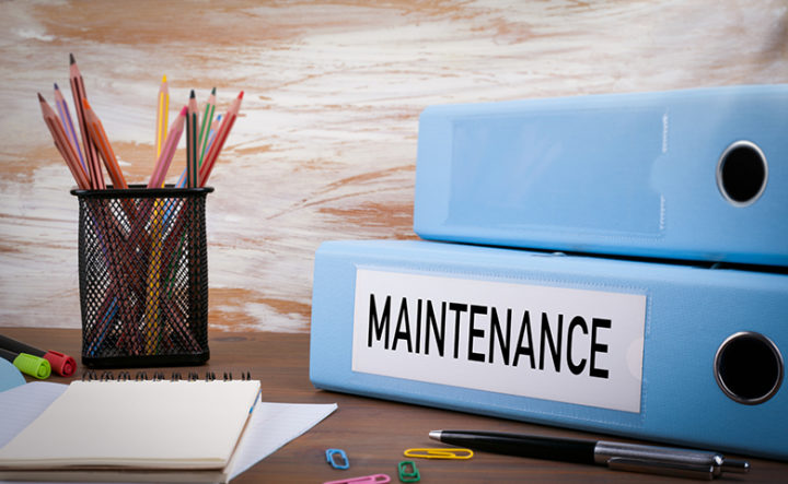 Maintenance, Office Binder on Wooden Desk