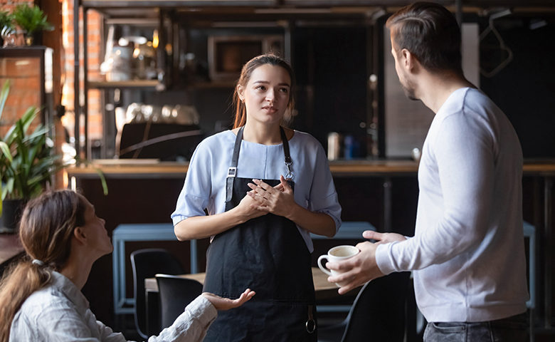 Young girl being blamed for something in a restaurant