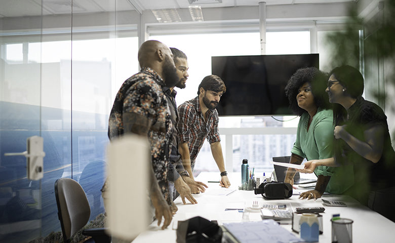 Business team discussing plans during business meeting