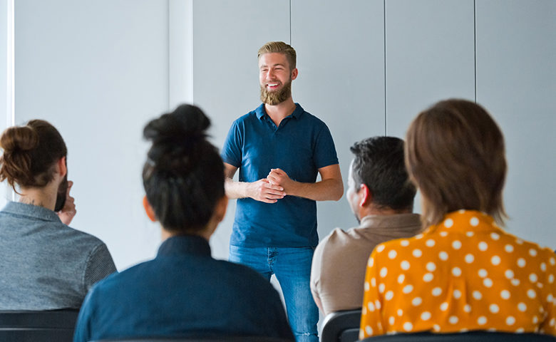 Man delivering toolbox talk to small group