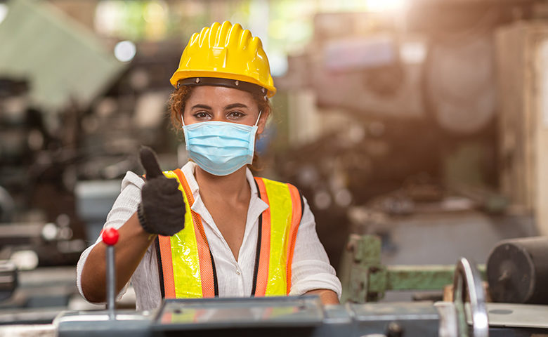 Women worker wear disposable face mask for protection Corona Virus Spreading and smoke dust air pollution filter in factory for healthy labor care.