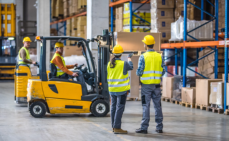 Forklift working in warehouse