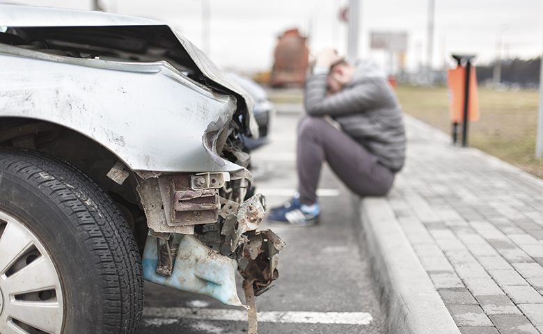 broken car after the accident in foreground