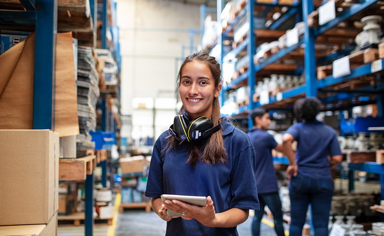 Confident female warehouse worker