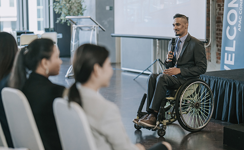 Keynote speaker addressing audience at a conference