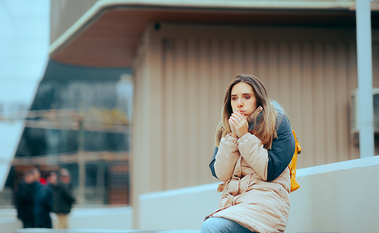 Woman Feeling Cold Waiting for the Bus in Wintertime